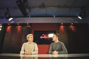 Two students at the Quays News newsdesk